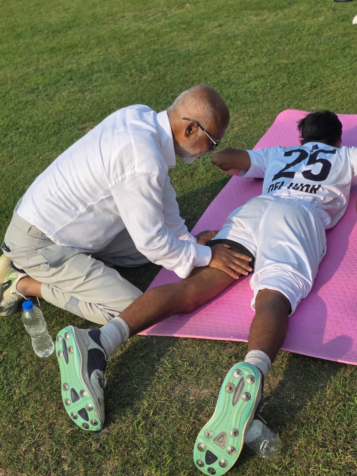 Mr. MD Akbar Babul helping players to do some stretching